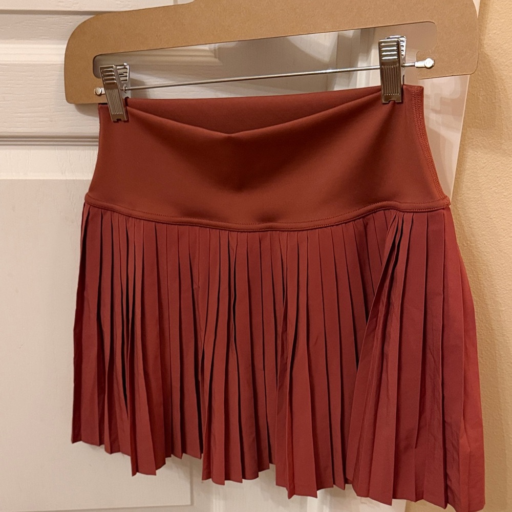 ALO Yoga Pleated Mini Skirt in Rust Amazon clay